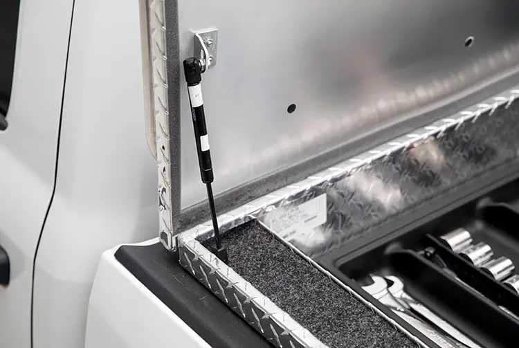 truck toolbox gas struts installed on an open toolbox lid